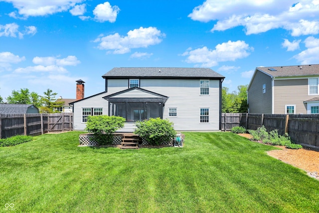rear view of house with a sunroom
