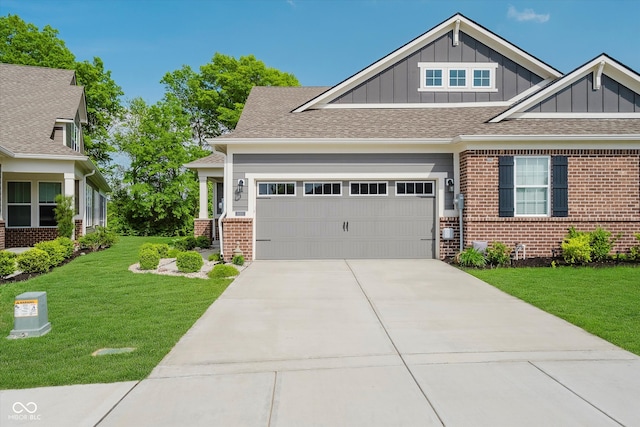 5020 Eldon Dr, Noblesville, IN 46062 - craftsman house featuring board and batten siding, brick siding, a front yard, and concrete driveway