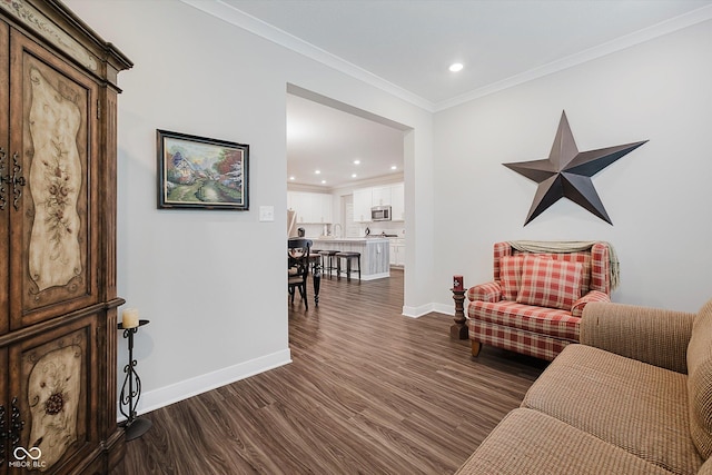 5020 Eldon Dr, Noblesville, IN 46062 - living area featuring dark wood-style floors, recessed lighting, crown molding, and baseboards