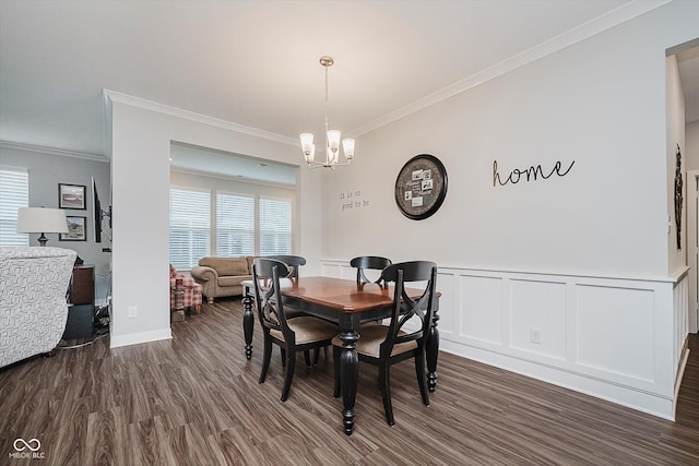 5020 Eldon Dr, Noblesville, IN 46062 - dining room featuring ornamental molding, a chandelier, dark wood finished floors, wainscoting, and a decorative wall