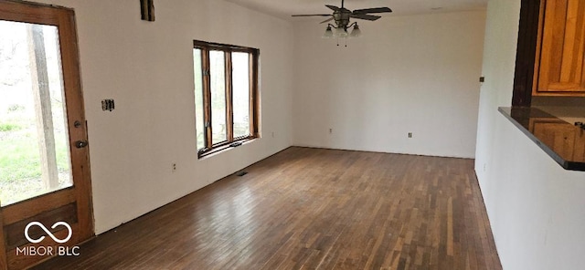 3854 Three Mile Rd, Centerville, IN 47330 - unfurnished dining area with dark wood finished floors, plenty of natural light, and a ceiling fan