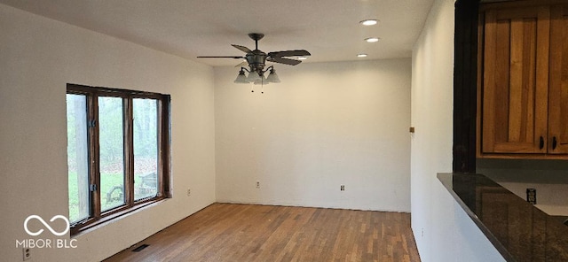 3854 Three Mile Rd, Centerville, IN 47330 - unfurnished dining area with ceiling fan, wood finished floors, and recessed lighting