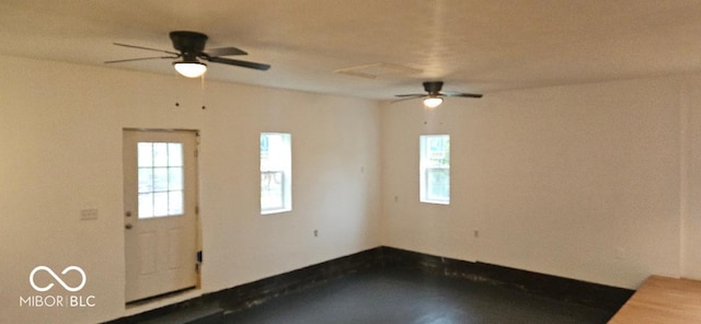 3854 Three Mile Rd, Centerville, IN 47330 - empty room with plenty of natural light and ceiling fan