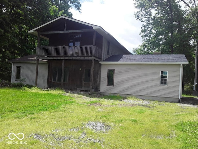 3854 Three Mile Rd, Centerville, IN 47330 - rear view of property featuring a lawn and a balcony