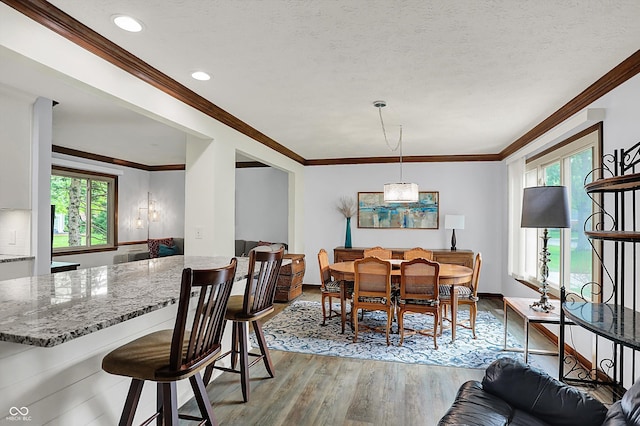 781 Dayton Dr, Carmel, IN 46033 - dining space with light wood-style flooring, healthy amount of natural light, ornamental molding, baseboards, and recessed lighting