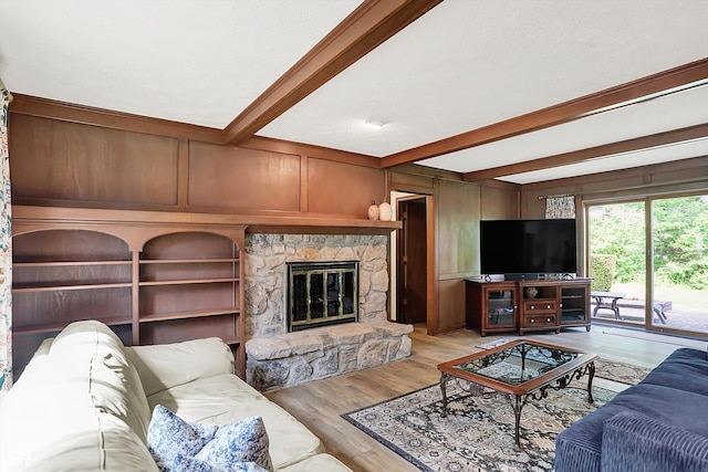 781 Dayton Dr, Carmel, IN 46033 - living room featuring beamed ceiling, a fireplace, light wood finished floors, and a decorative wall