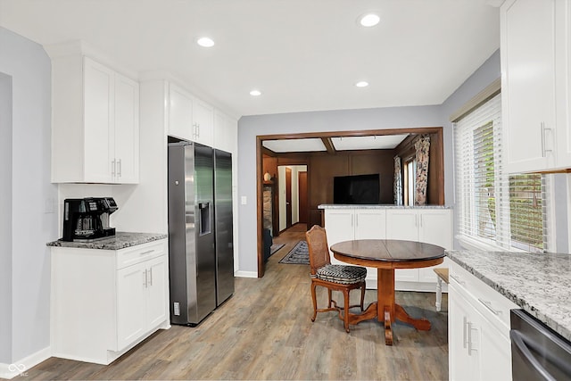 781 Dayton Dr, Carmel, IN 46033 - kitchen with stainless steel appliances, light wood finished floors, baseboards, white cabinetry, and recessed lighting