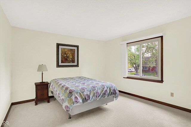 781 Dayton Dr, Carmel, IN 46033 - bedroom featuring baseboards and light colored carpet