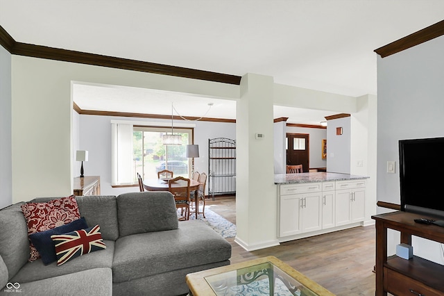 781 Dayton Dr, Carmel, IN 46033 - living area featuring ornamental molding, wood finished floors, and baseboards