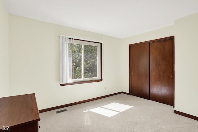 781 Dayton Dr, Carmel, IN 46033 - unfurnished bedroom featuring baseboards, carpet flooring, and a closet
