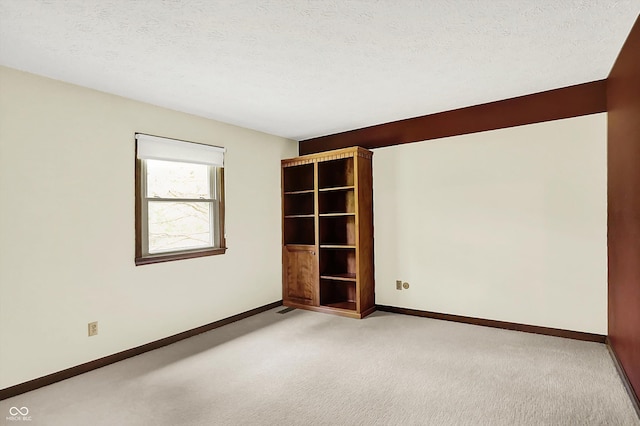 781 Dayton Dr, Carmel, IN 46033 - carpeted spare room featuring baseboards and a textured ceiling