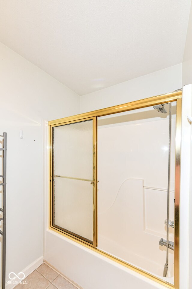 7645 Briarstone Ln, Indianapolis, IN 46227 - full bath with shower / bath combination with glass door and tile patterned floors