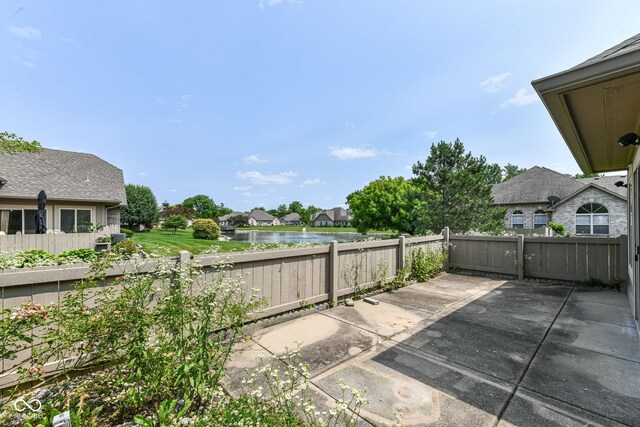 7645 Briarstone Ln, Indianapolis, IN 46227 - fenced backyard featuring a patio and a water view
