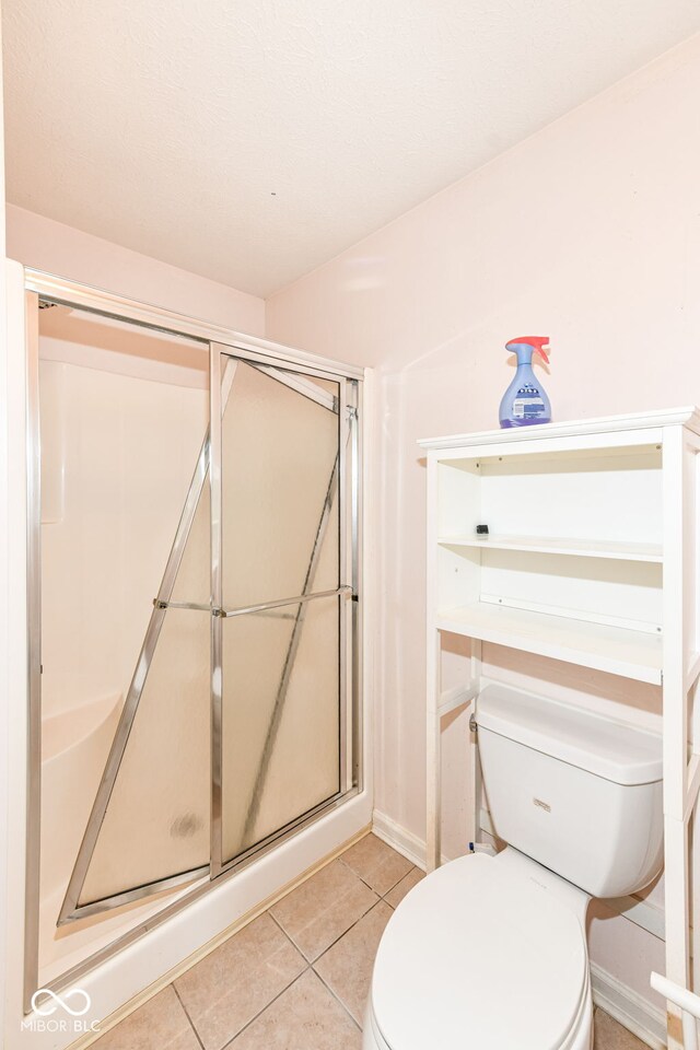7645 Briarstone Ln, Indianapolis, IN 46227 - bathroom featuring a stall shower and tile patterned floors
