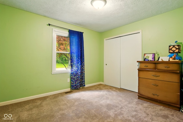 6462 Wings Ct, Brownsburg, IN 46112 - unfurnished bedroom with carpet, a closet, a textured ceiling, and baseboards