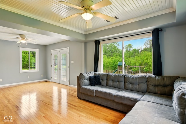 6462 Wings Ct, Brownsburg, IN 46112 - living room featuring a ceiling fan, ornamental molding, light wood-type flooring, baseboards, and french doors