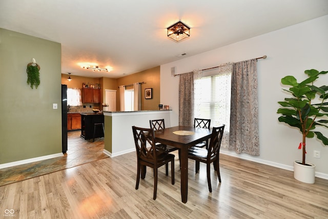 7604 Cloudy Ct, Camby, IN 46113 - dining room with light wood-style floors and baseboards