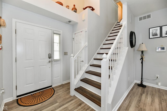 7604 Cloudy Ct, Camby, IN 46113 - entryway with light wood-style floors, stairs, and baseboards