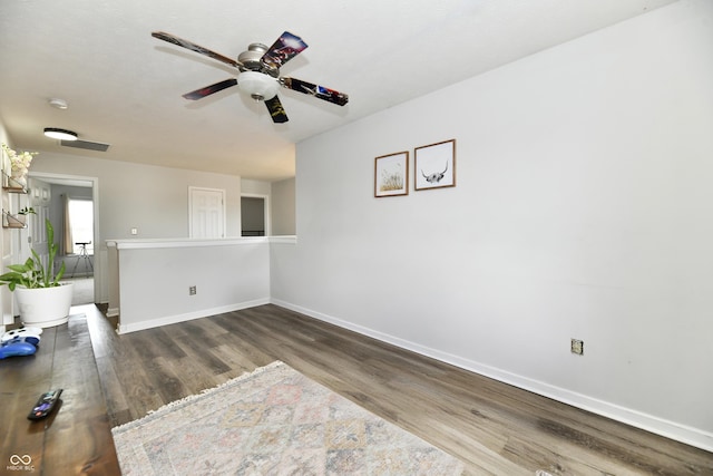 7604 Cloudy Ct, Camby, IN 46113 - unfurnished room featuring baseboards, wood finished floors, a ceiling fan, and a smoke detector