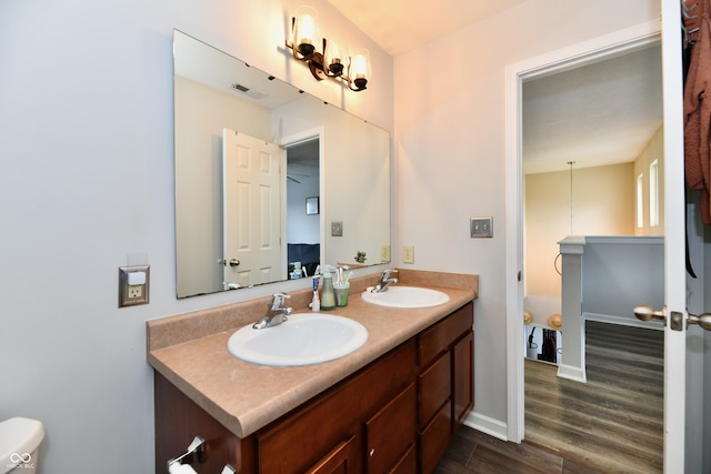 7604 Cloudy Ct, Camby, IN 46113 - full bathroom featuring wood finished floors, double vanity, and baseboards
