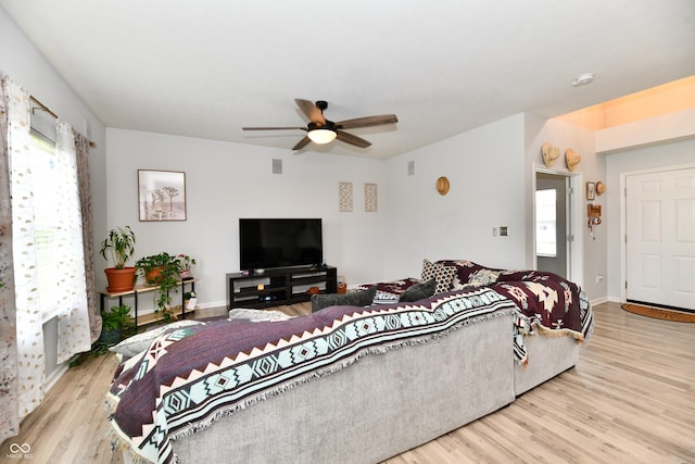 7604 Cloudy Ct, Camby, IN 46113 - living area featuring wood finished floors, a ceiling fan, and baseboards