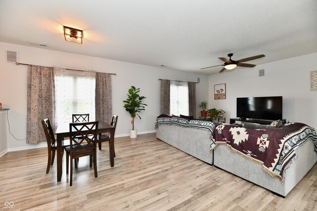 7604 Cloudy Ct, Camby, IN 46113 - living area with light wood-style flooring, ceiling fan, and baseboards