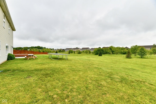 7604 Cloudy Ct, Camby, IN 46113 - view of grassy yard with a trampoline