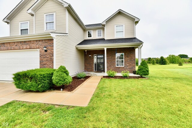 7604 Cloudy Ct, Camby, IN 46113 - traditional-style home featuring brick siding, a garage, a front lawn, and a porch