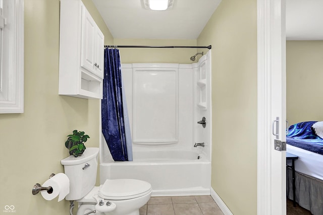 bathroom featuring tile patterned floors, toilet, shower / tub combo with curtain, and baseboards