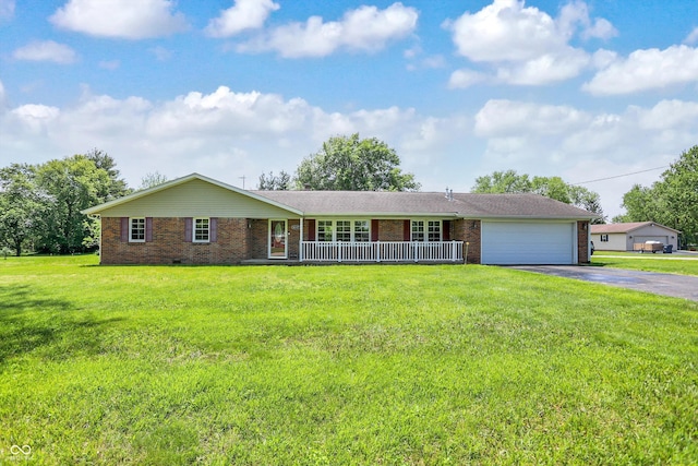 single story home with covered porch, brick siding, asphalt driveway, and an attached garage