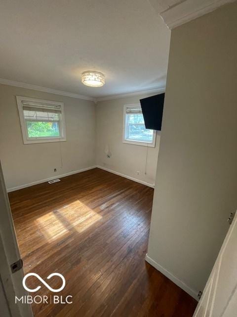 5802 Bertha St, Indianapolis, IN 46241 - empty room with crown molding, baseboards, and dark wood-style flooring
