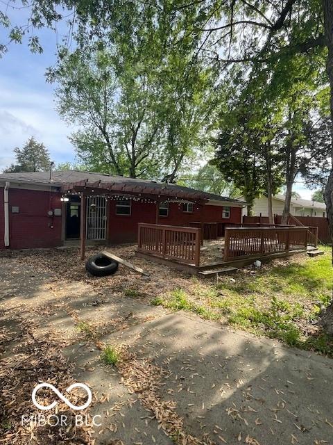 5802 Bertha St, Indianapolis, IN 46241 - rear view of property featuring a patio area and a wooden deck