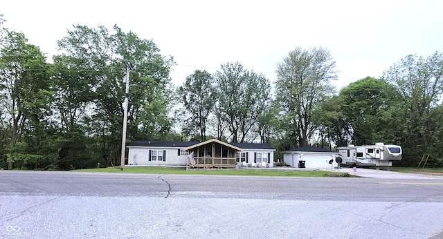 5269 W State Road 42, Brazil, IN 47834 - view of front of property with a deck, a front yard, and view of scattered trees