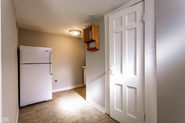 5428 E 10th St, Indianapolis, IN 46219 - kitchen with freestanding refrigerator and baseboards