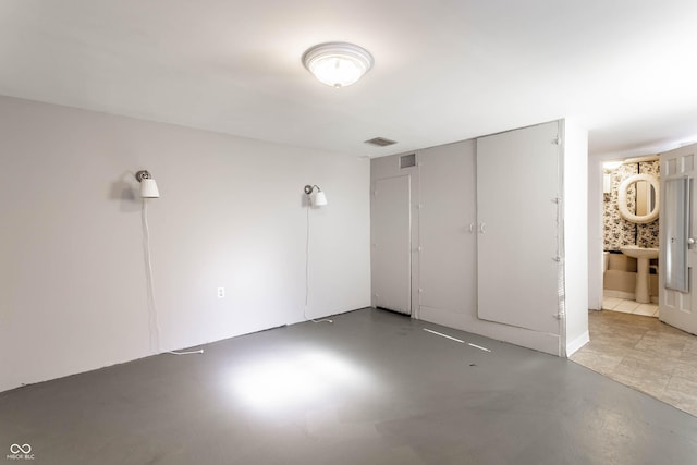 5428 E 10th St, Indianapolis, IN 46219 - unfurnished bedroom featuring concrete floors
