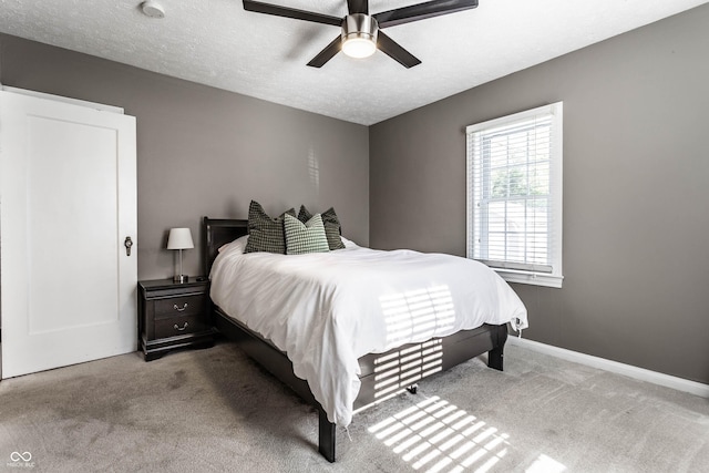 5428 E 10th St, Indianapolis, IN 46219 - carpeted bedroom featuring ceiling fan, baseboards, and a textured ceiling