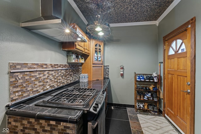 2134 N Alabama St, Indianapolis, IN 46202 - kitchen with ornamental molding, wall chimney exhaust hood, tasteful backsplash, gas stove, and baseboards