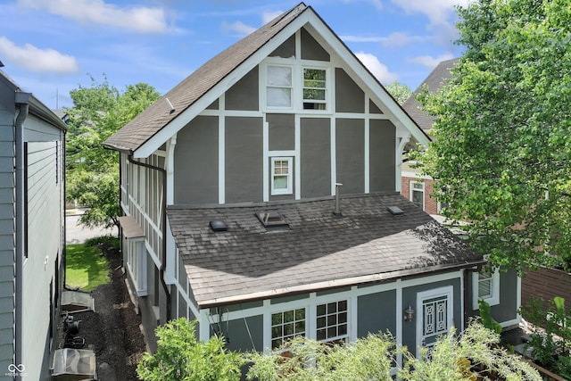 2134 N Alabama St, Indianapolis, IN 46202 - back of property featuring a shingled roof and stucco siding