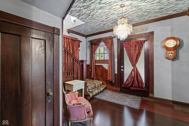 2134 N Alabama St, Indianapolis, IN 46202 - foyer featuring stairs, ornamental molding, a chandelier, hardwood / wood-style flooring, and baseboards