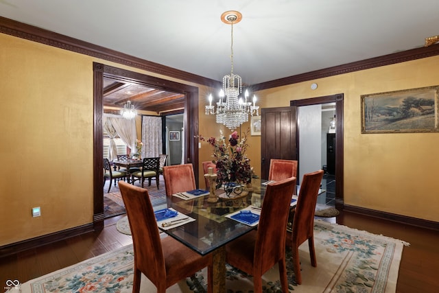 2134 N Alabama St, Indianapolis, IN 46202 - dining space featuring a chandelier, hardwood / wood-style floors, baseboards, and ornamental molding