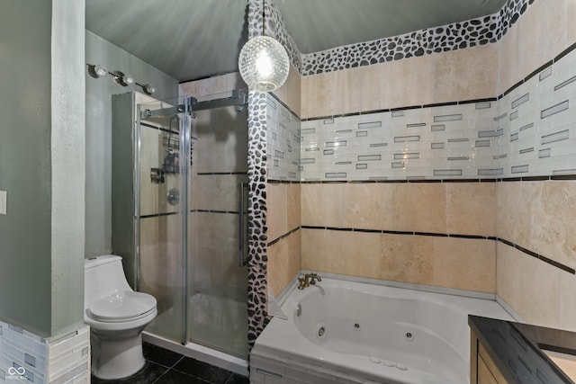 2134 N Alabama St, Indianapolis, IN 46202 - bathroom featuring a stall shower, a whirlpool tub, toilet, and tile patterned flooring