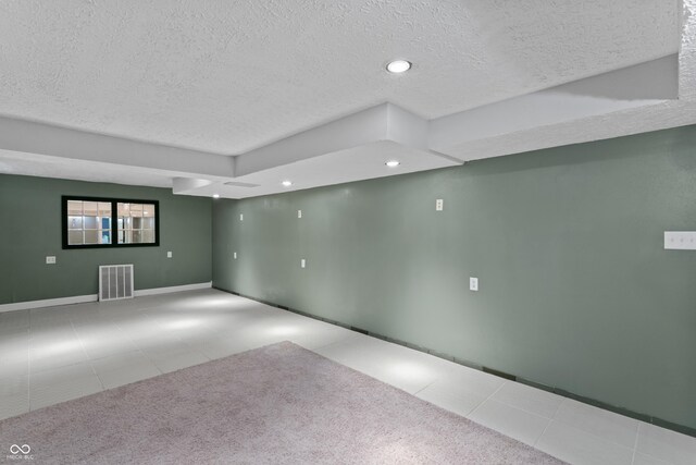 2134 N Alabama St, Indianapolis, IN 46202 - tiled spare room with a textured ceiling, recessed lighting, and baseboards