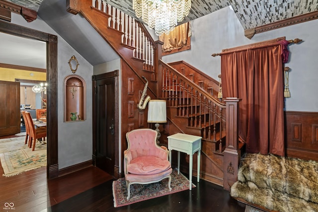 2134 N Alabama St, Indianapolis, IN 46202 - staircase with a chandelier, wood-type flooring, and baseboards