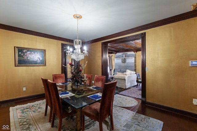 2134 N Alabama St, Indianapolis, IN 46202 - dining room featuring a chandelier, hardwood / wood-style flooring, baseboards, and crown molding