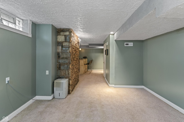2134 N Alabama St, Indianapolis, IN 46202 - below grade area with carpet flooring, a textured ceiling, and baseboards