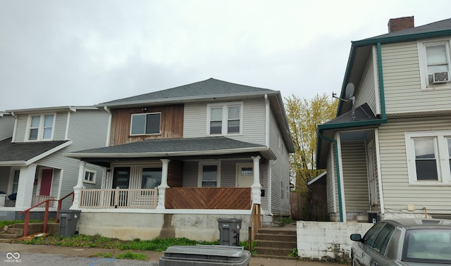 view of front of home with covered porch and cooling unit