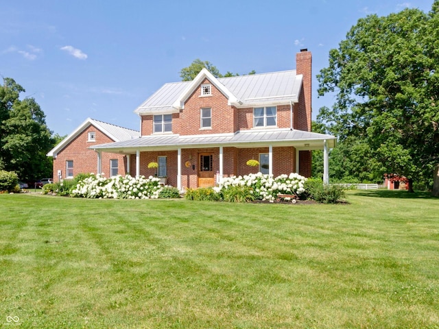 19702 Centennial Rd, Sheridan, IN 46069 - view of front of property featuring a chimney, a standing seam roof, a front yard, and a porch