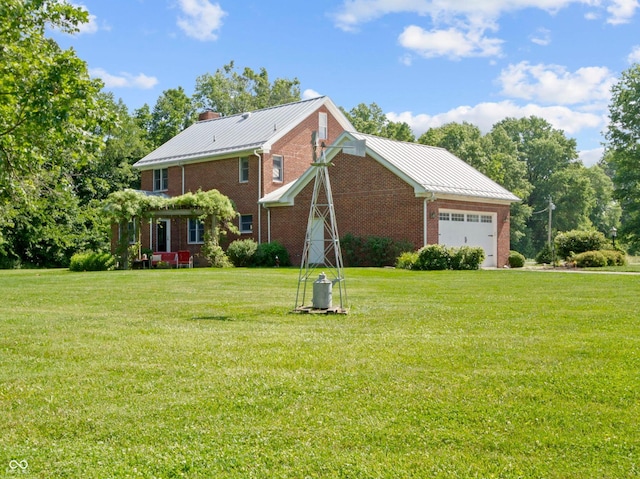 19702 Centennial Rd, Sheridan, IN 46069 - view of front of property featuring brick siding, a front yard, an attached garage, a chimney, and a metal roof