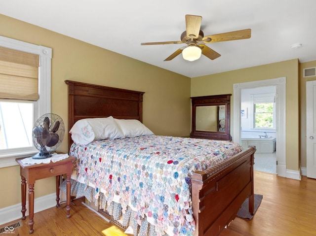 19702 Centennial Rd, Sheridan, IN 46069 - bedroom featuring light wood-style floors, a ceiling fan, and connected bathroom