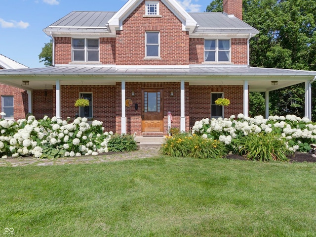 19702 Centennial Rd, Sheridan, IN 46069 - view of front facade featuring a standing seam roof, brick siding, a porch, and a front yard